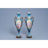 A pair of French gold layered 'bleu celeste' ground bronze mounted vases and covers in the Svres ma
