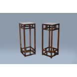 A pair of Chinese square wood stands, 19th/20th C.