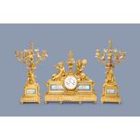 A French gilt bronze three-piece clock garniture with musicians and Svres style plaques, 19th C.