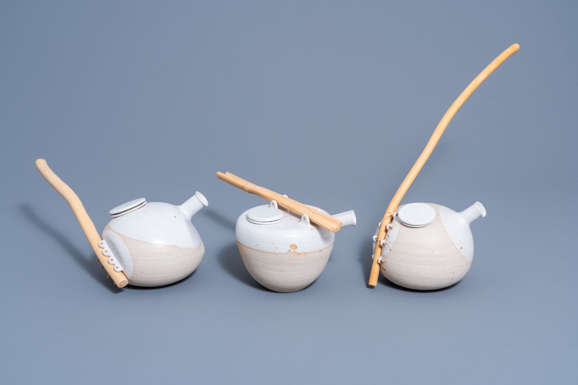 Frits Vandenbussche (1942): Three partly glazed stoneware teapots and covers with wood handles, 20th