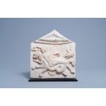 After the antique: A carved white marble alto relievo fragment depicting a nymph and a sea monster,