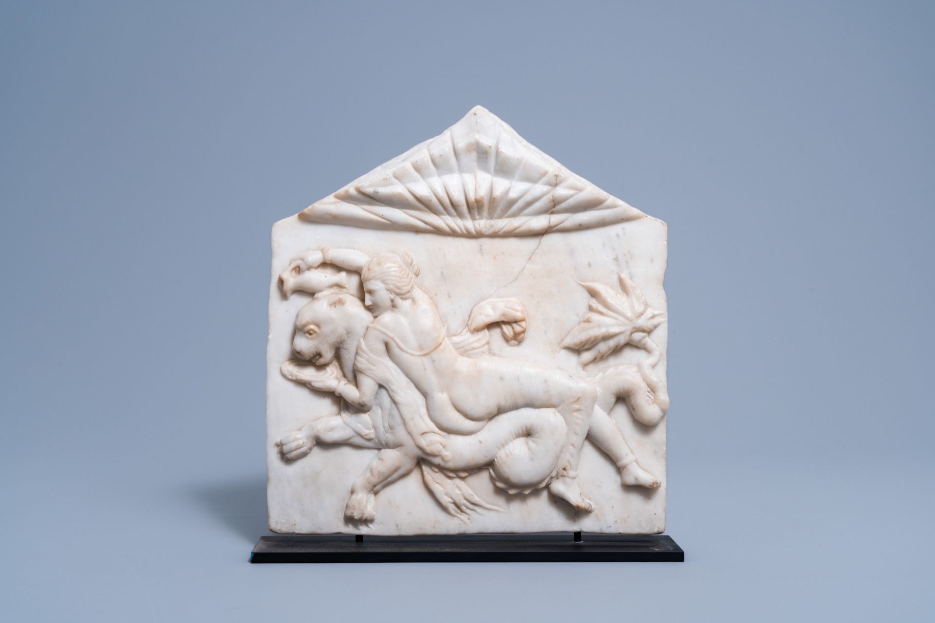 After the antique: A carved white marble alto relievo fragment depicting a nymph and a sea monster,