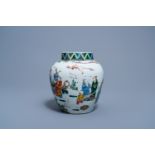 A Chinese famille rose jar and cover with figures in a landscape, 19th C.