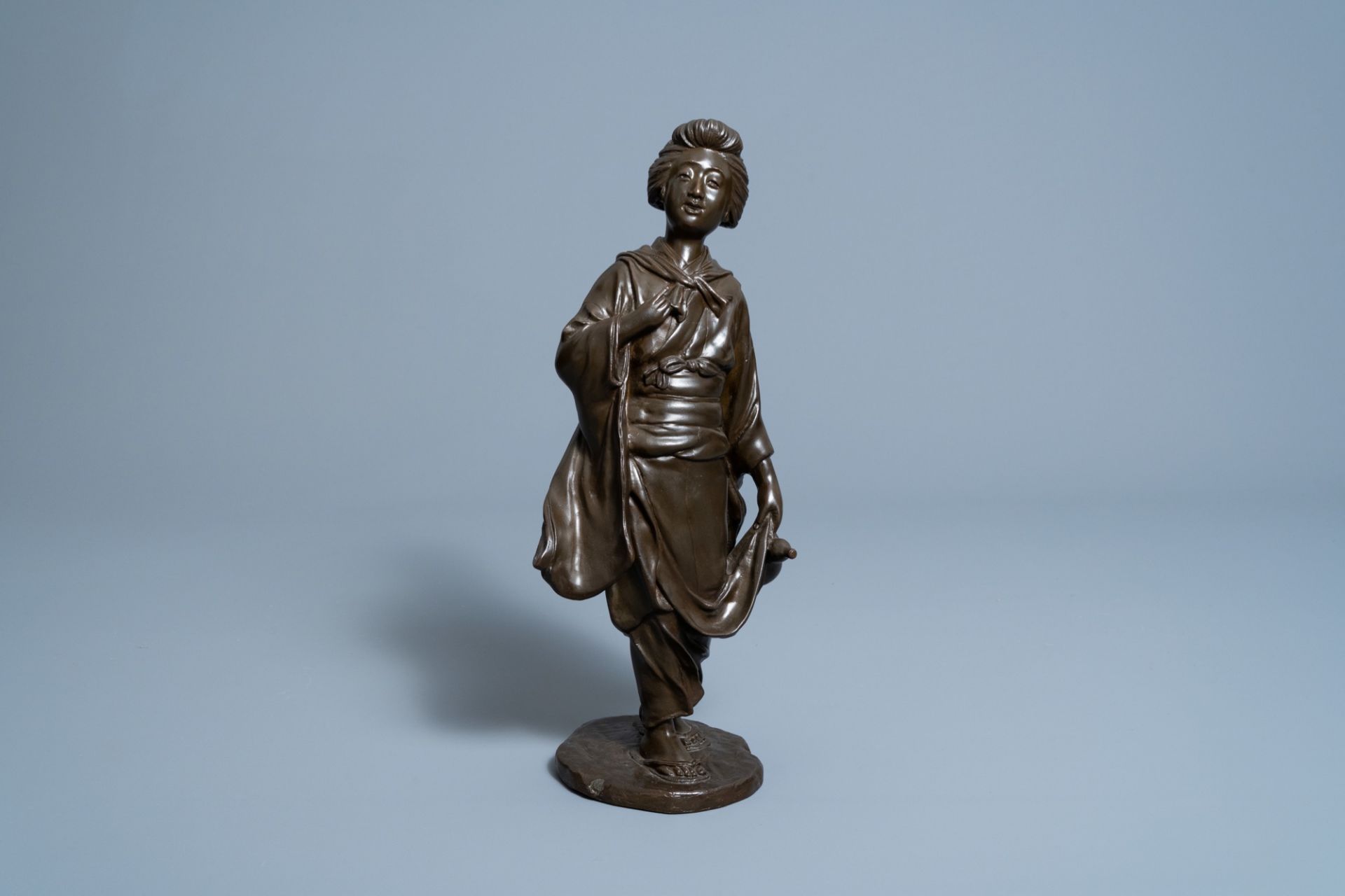 A Japanese bronze okimono of a lady with a gourd, signed Seiya, Meiji, 19th C.
