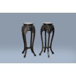 Two Chinese carved wood stands with marble top, 19th/20th C.