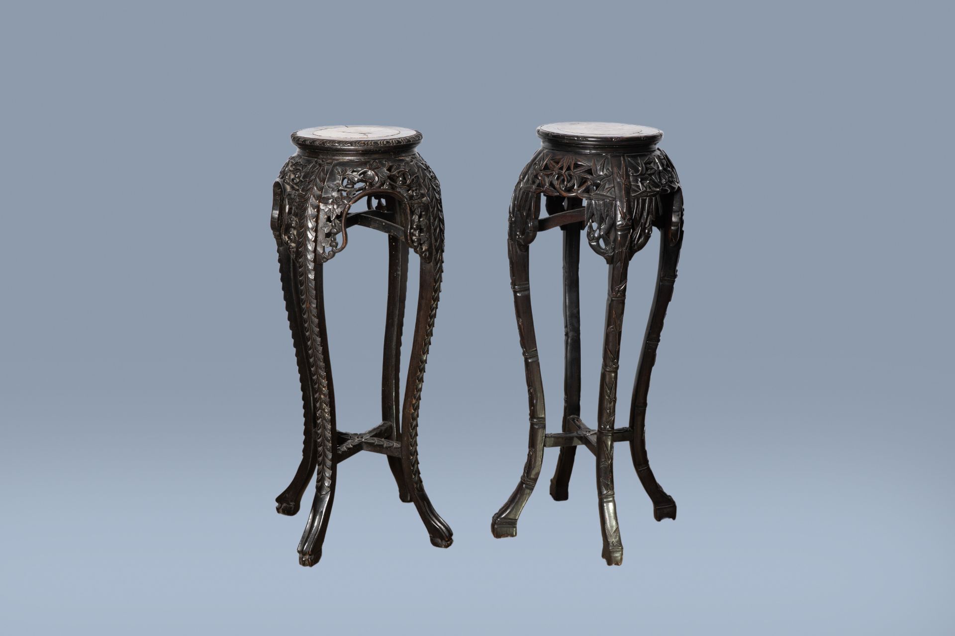 Two Chinese carved wood stands with marble top, 19th/20th C.