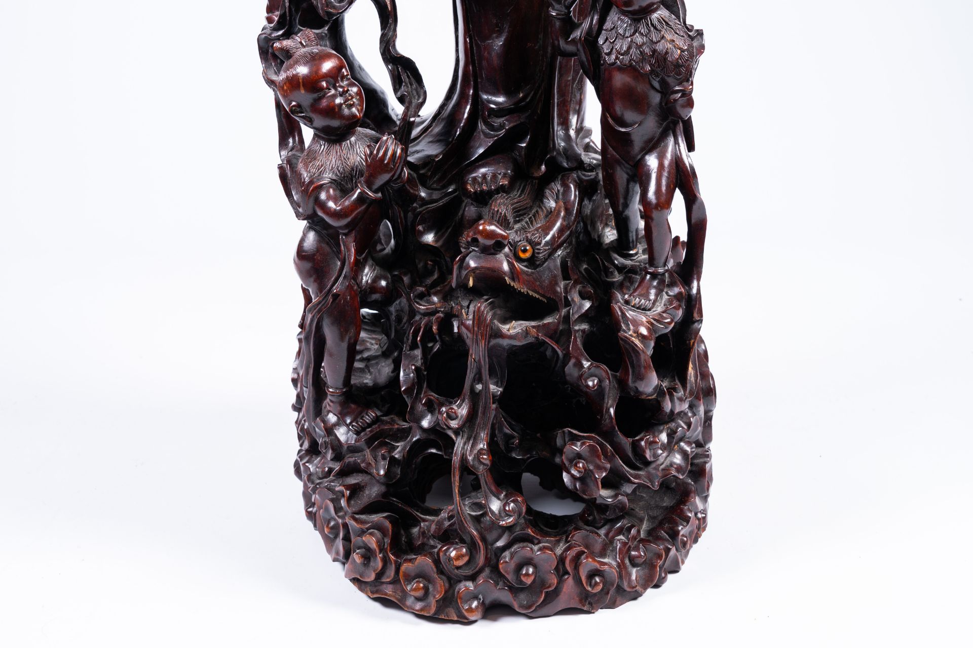 A massive Chinese carved wood group with a Guanyin, children and a dragon, 20th C. - Image 9 of 14
