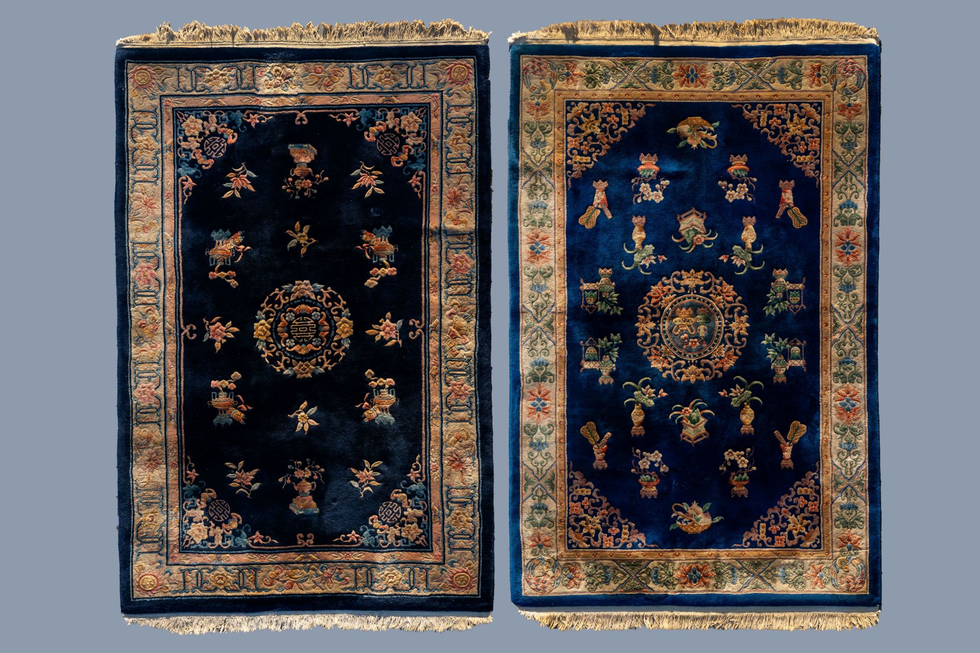 Two Chinese woolen 'Beijing' carpets with antiquities design, 20th C.