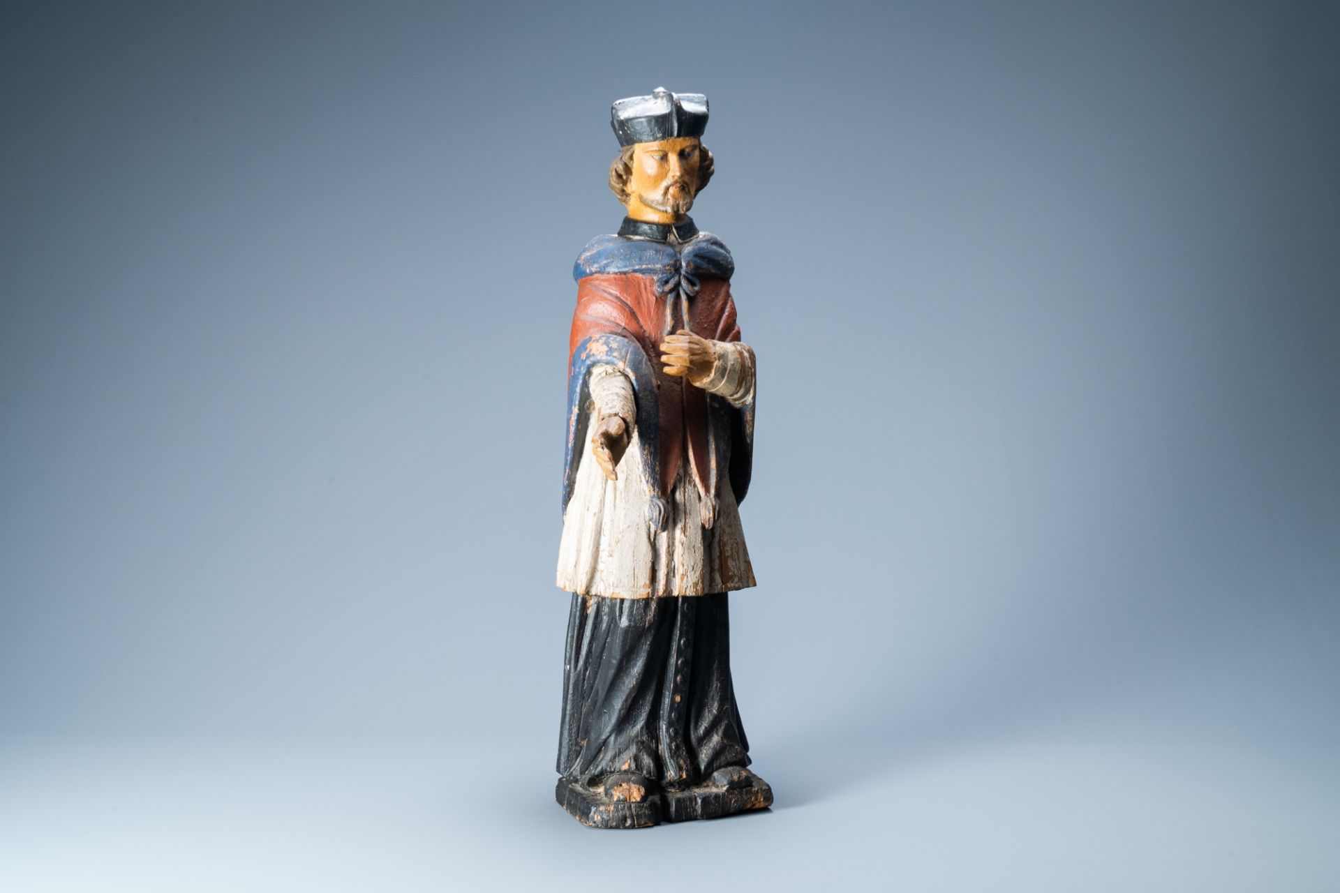 A carved and polychrome painted wooden figure of Saint John of Nepomuk, probably Germany, 17th/18th
