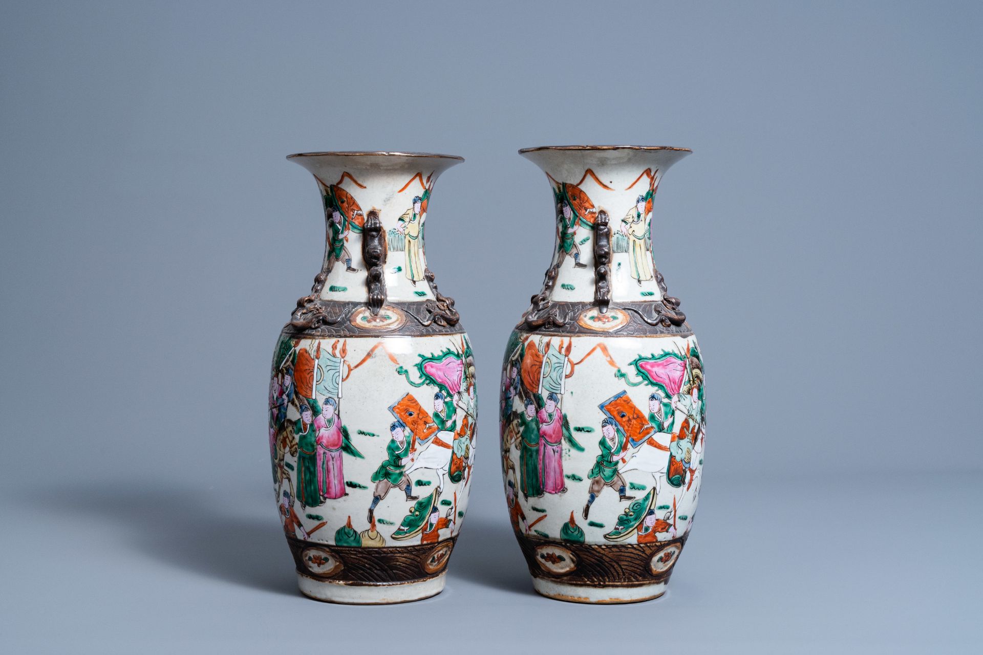 A pair of Chinese Nanking crackle glazed famille rose vases with warrior scenes, 19th C. - Image 2 of 6