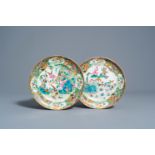 Two Chinese Canton famille rose plates with butterflies and birds among blossoming branches, 19th C.