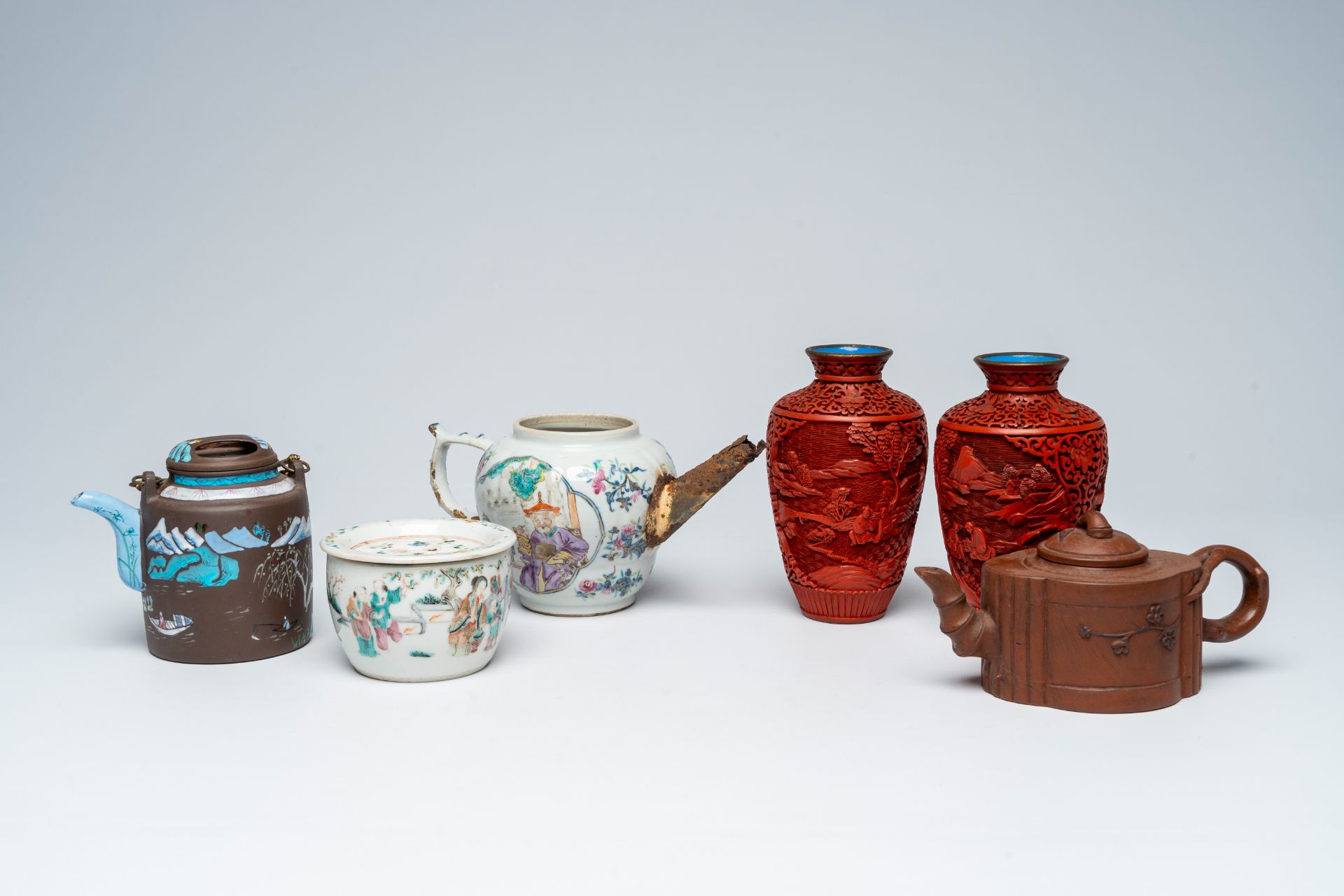 A varied collection of Chinese stoneware, lacquerware and famille rose and qianjiang cai porcelain,