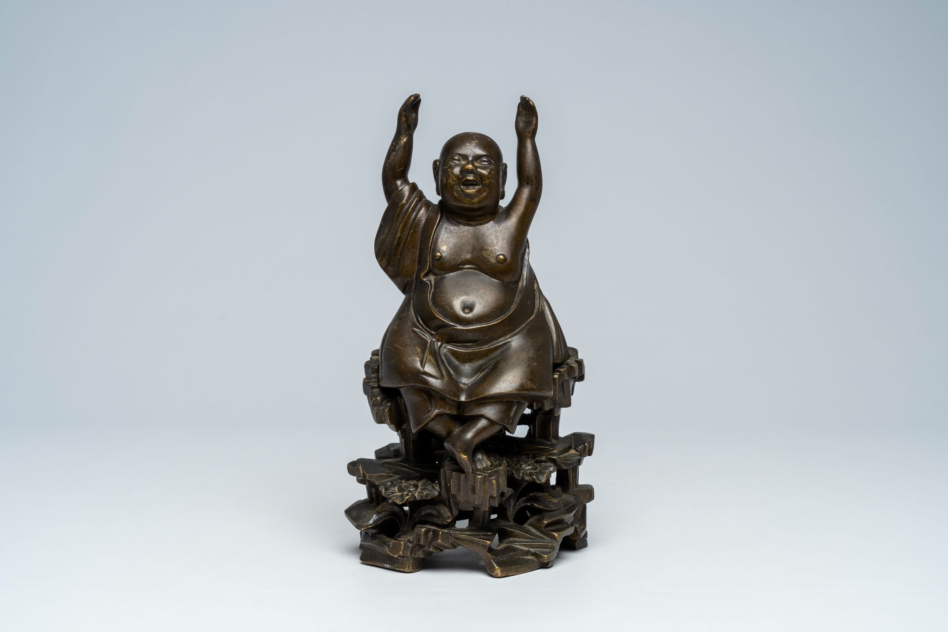 A Vietnamese bronze figure of Buddha seated on a rock, 19th C. - Image 2 of 7