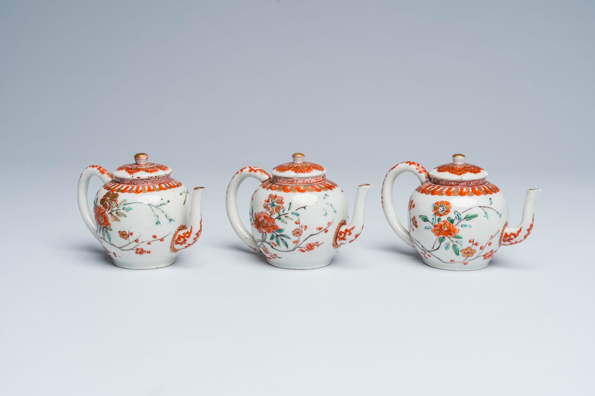 Three Japanese Kakiemon style teapots and covers with floral design, Edo, late 17th C.