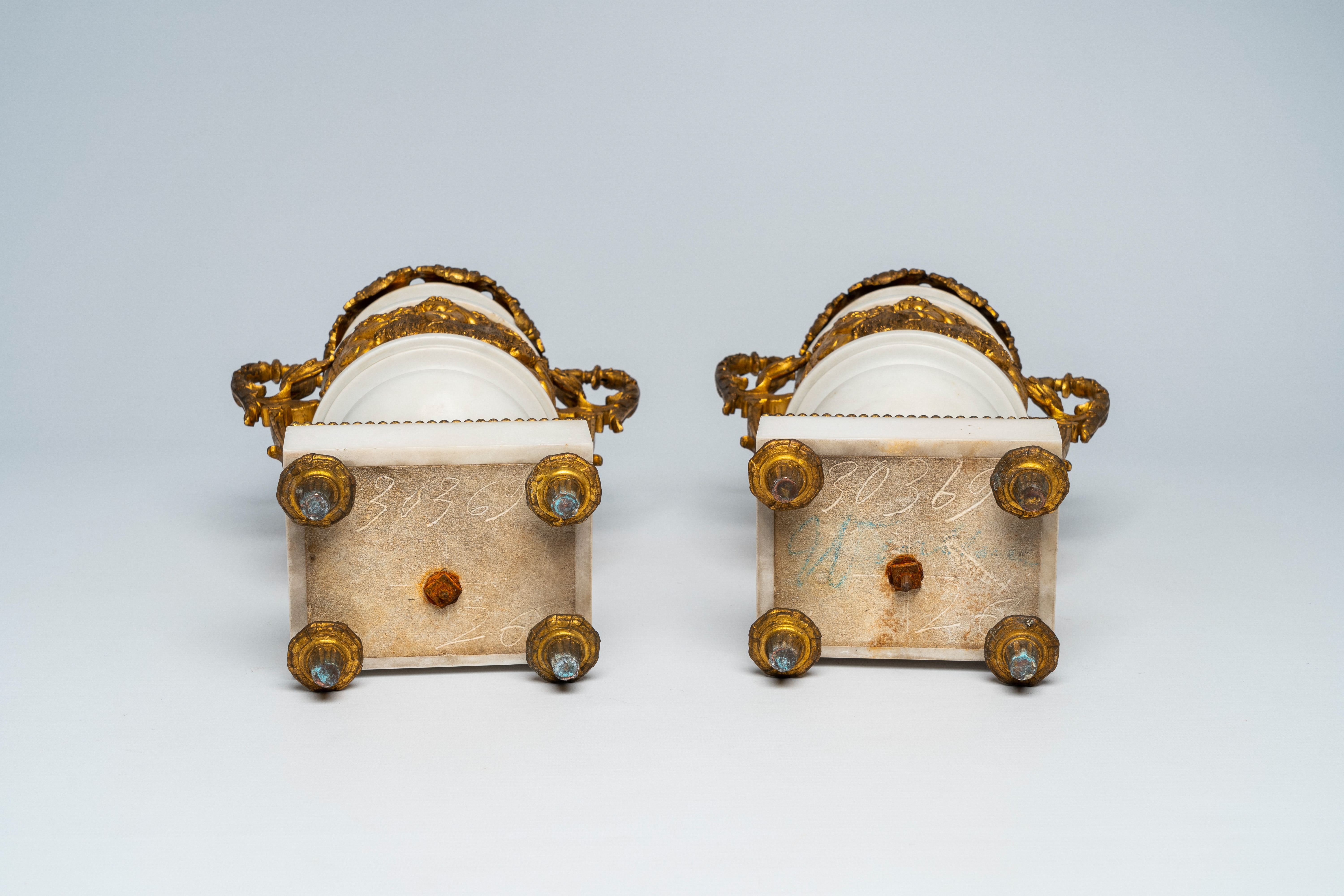 A pair of French gilt mounted white marble vases with relief design of putti, goats and Bacchus them - Image 6 of 7