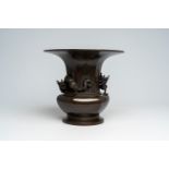 A Japanese patinated bronze vase with applied dragon design, Meiji, 19th C.
