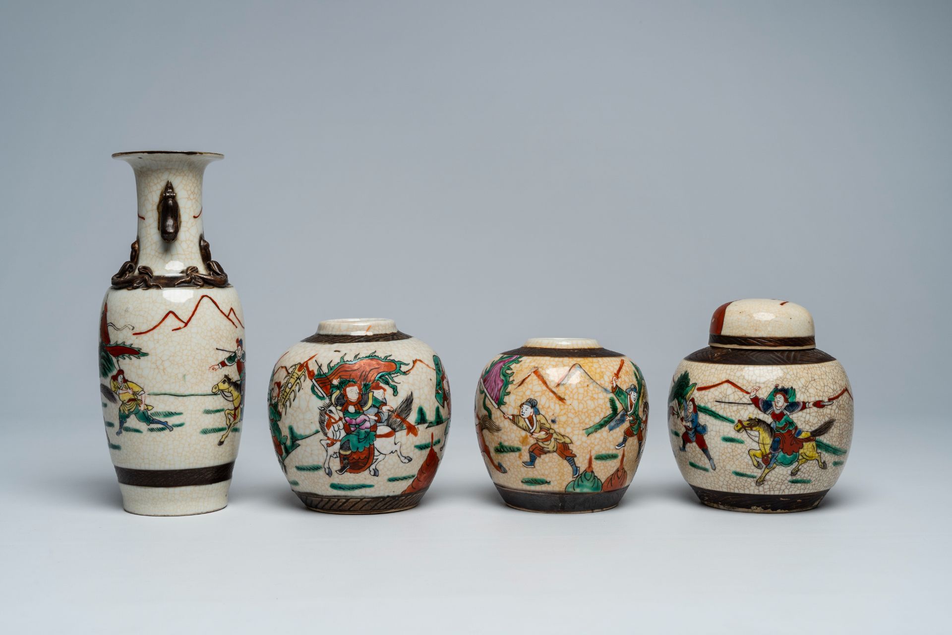A varied collection of Chinese Nanking crackle glazed famille rose and verte vases and jars with war - Bild 9 aus 13