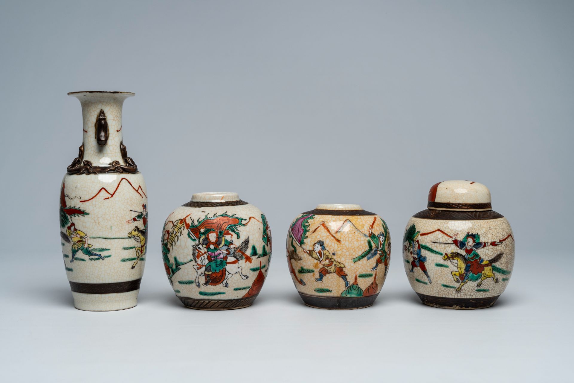 A varied collection of Chinese Nanking crackle glazed famille rose and verte vases and jars with war - Image 9 of 13