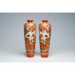 A pair of Japanese Kutani vases with ladies during ikebana and peacocks among blossoming branches, M