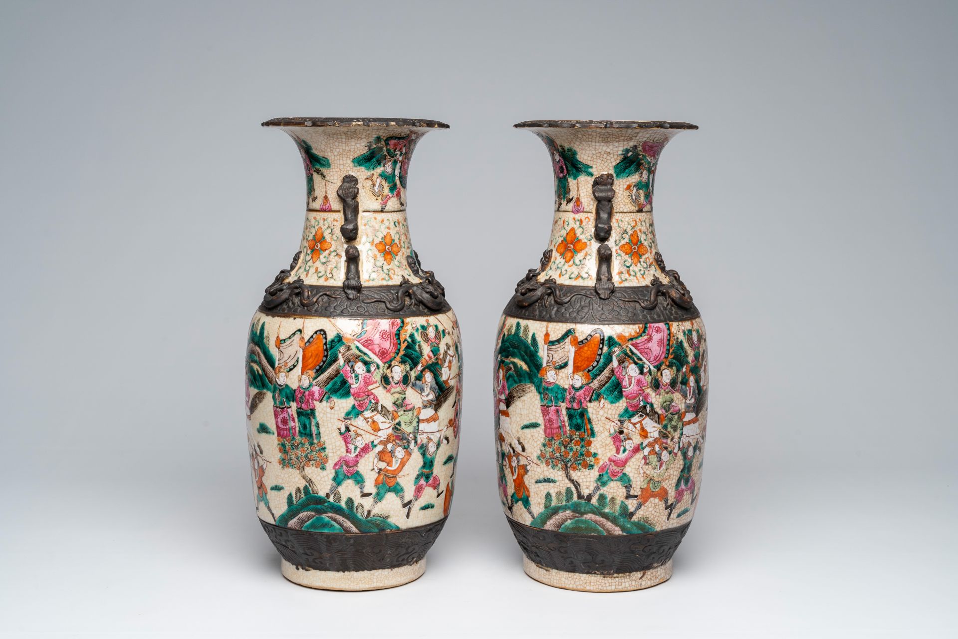 A pair of Chinese Nanking crackle glazed famille rose 'warrior' vases, 19th C. - Image 3 of 6