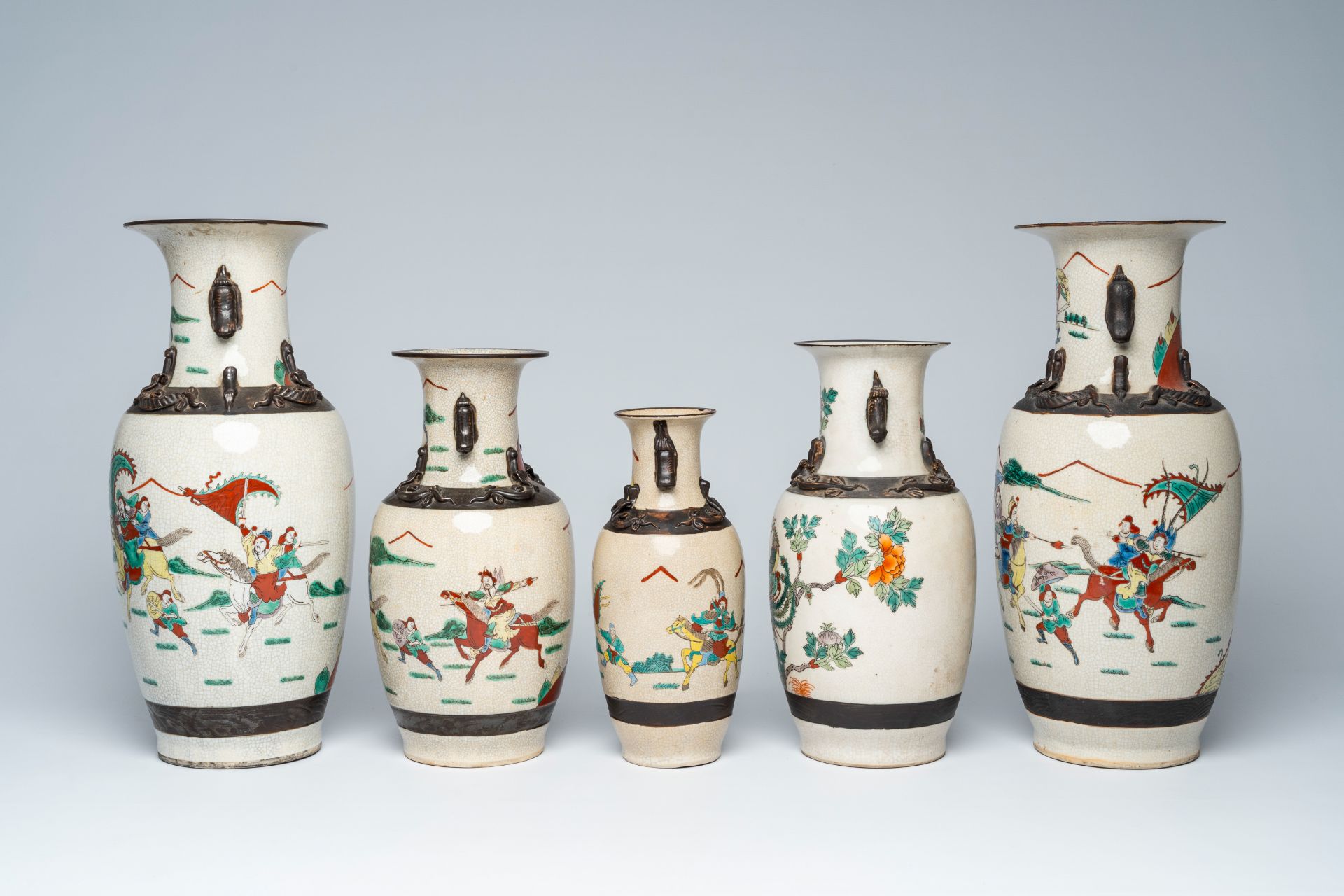 A varied collection of ten Chinese Nanking crackle glazed famille verte vases with warrior scenes an - Image 9 of 13