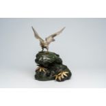 A Japanese patinated and silver-plated metal okimono of an eagle on a rock, signed Hidemasa, 20th C.