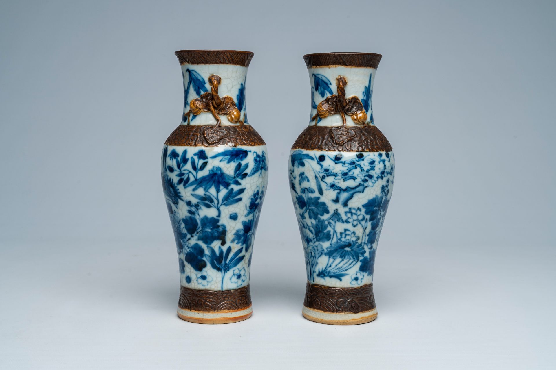 A pair of Chinese Nanking crackle glazed blue and white vases with birds and butterflies among bloss - Image 4 of 6