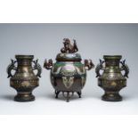 A pair of Japanese champlevÃ© vases with floral design and an incense burner with relief design of l