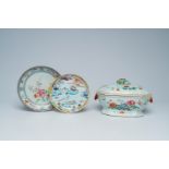 A Chinese famille rose tureen and cover and two famille rose plates with an animated landscape and f