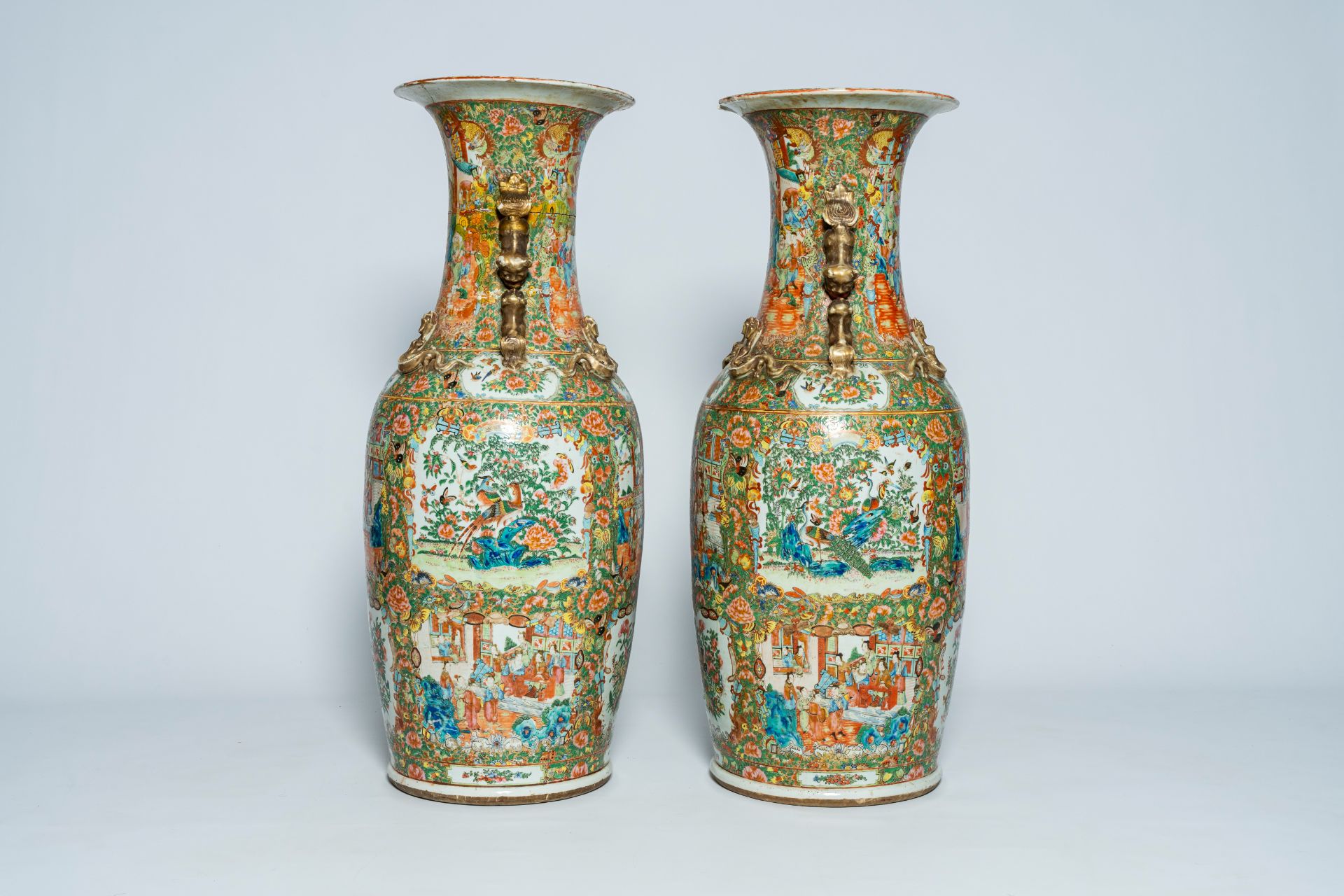 A pair of large Chinese Canton famille rose vases with palace scenes and floral design, 19th C. - Image 4 of 6