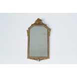 A French gilt wood mirror with floral design, 19th C.