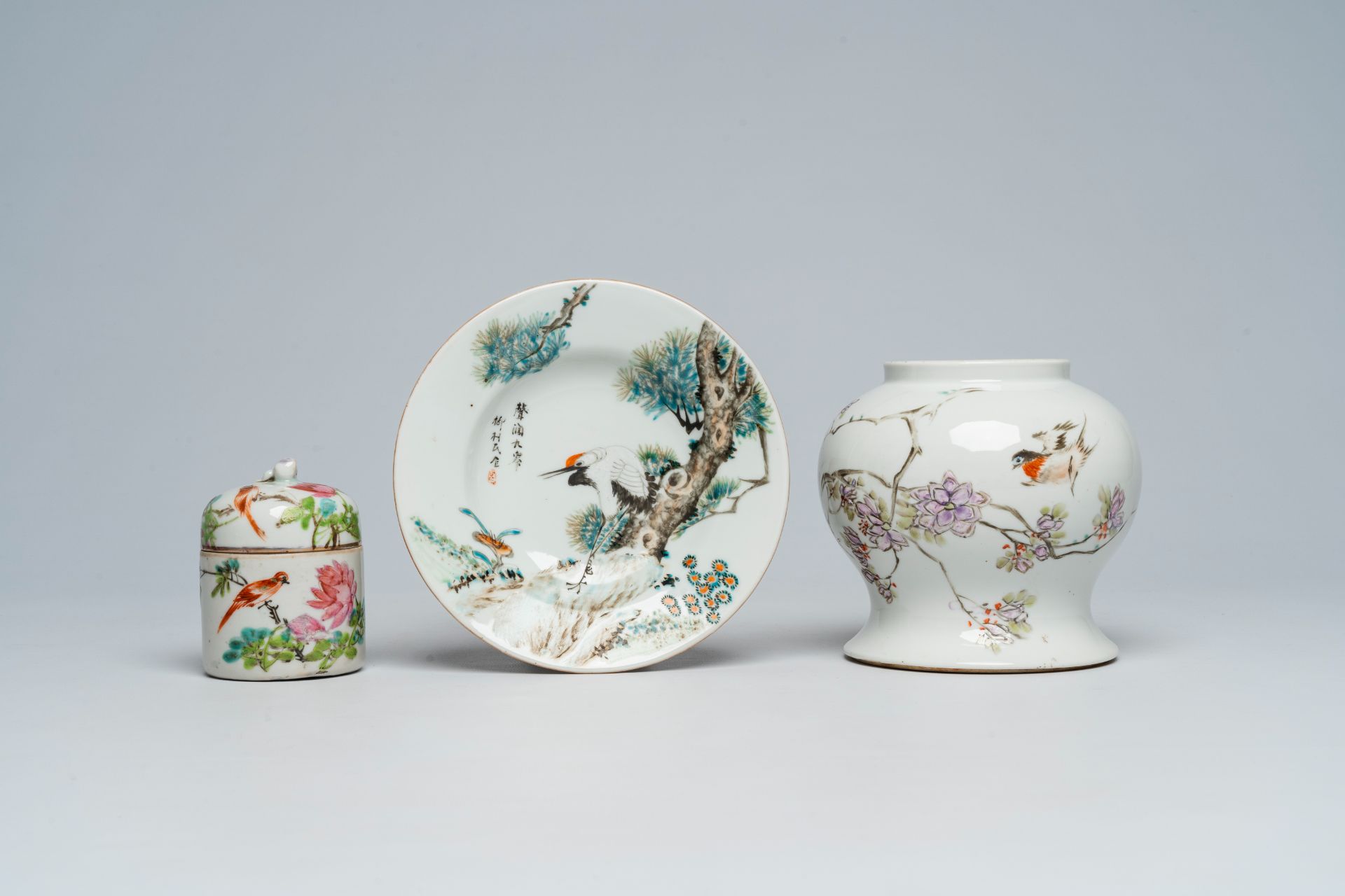 A Chinese qianjiang cai jar and cover, a dish and a vase with birds among blossoming branches, 19th/