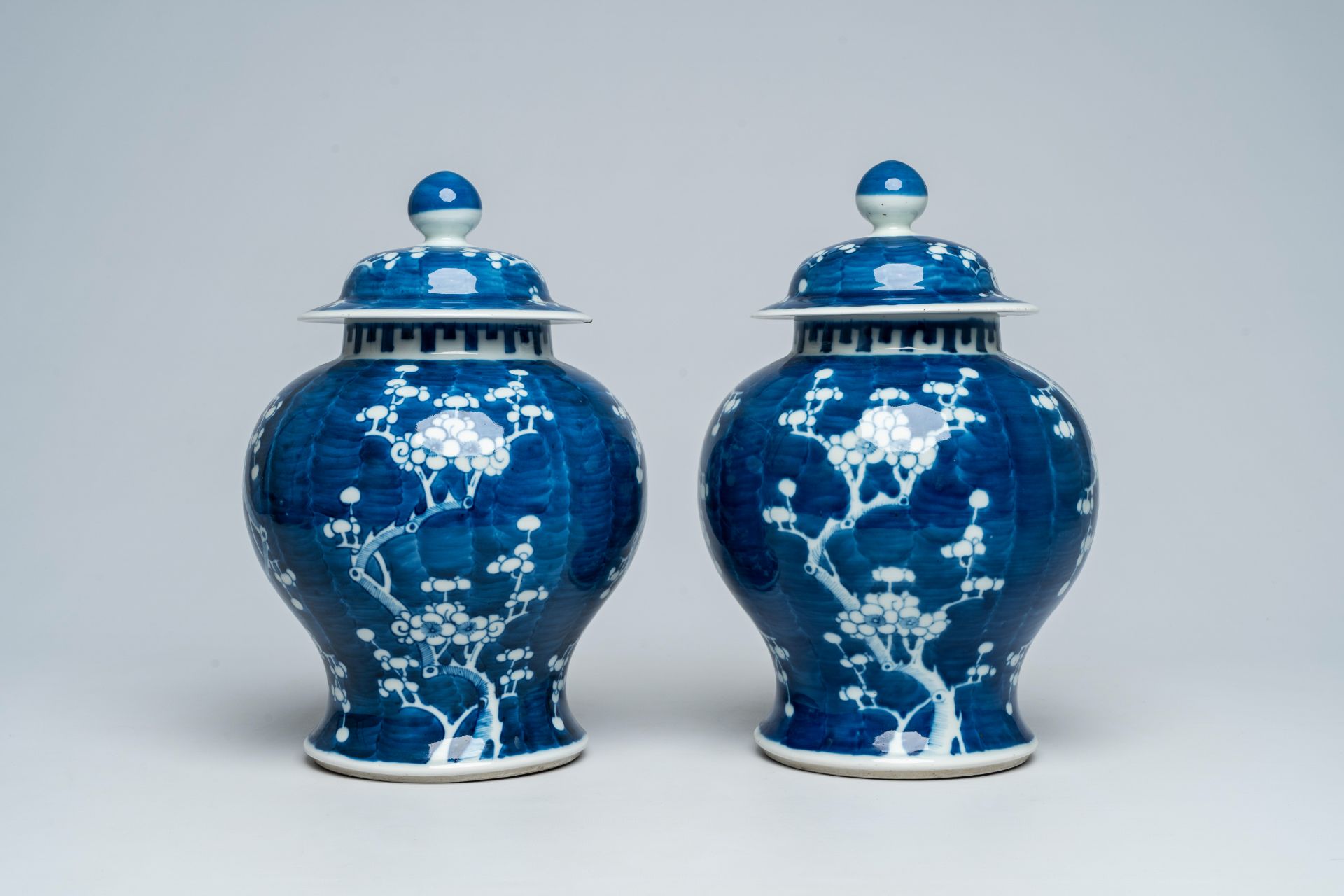 A pair of Chinese blue and white prunus on cracked ice ground vases and covers, 19th C. - Image 2 of 6