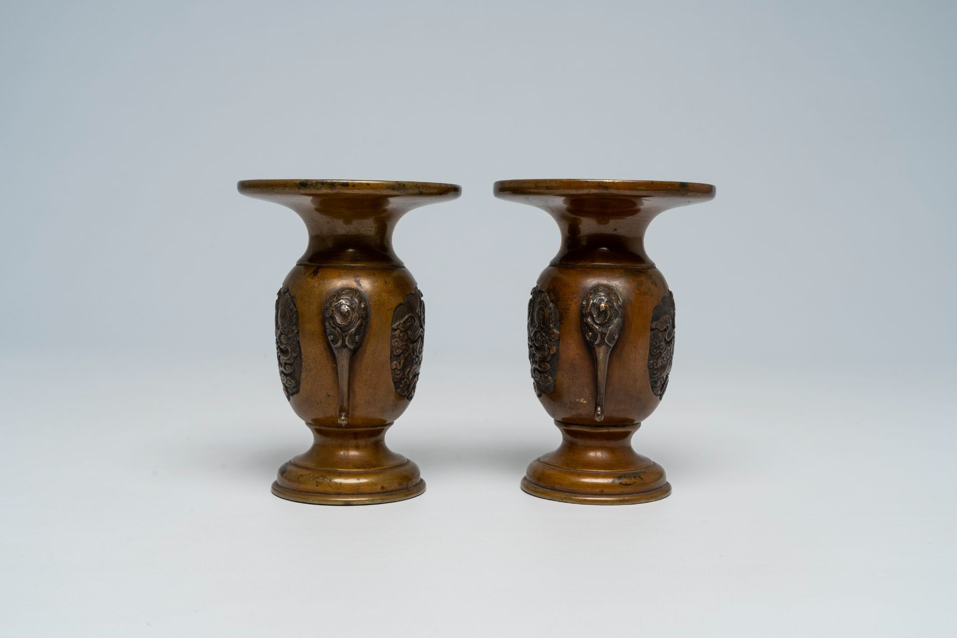 A pair of Japanese bronze vases, two mixed metal chargers with relief design, a blue and white dish - Image 17 of 21