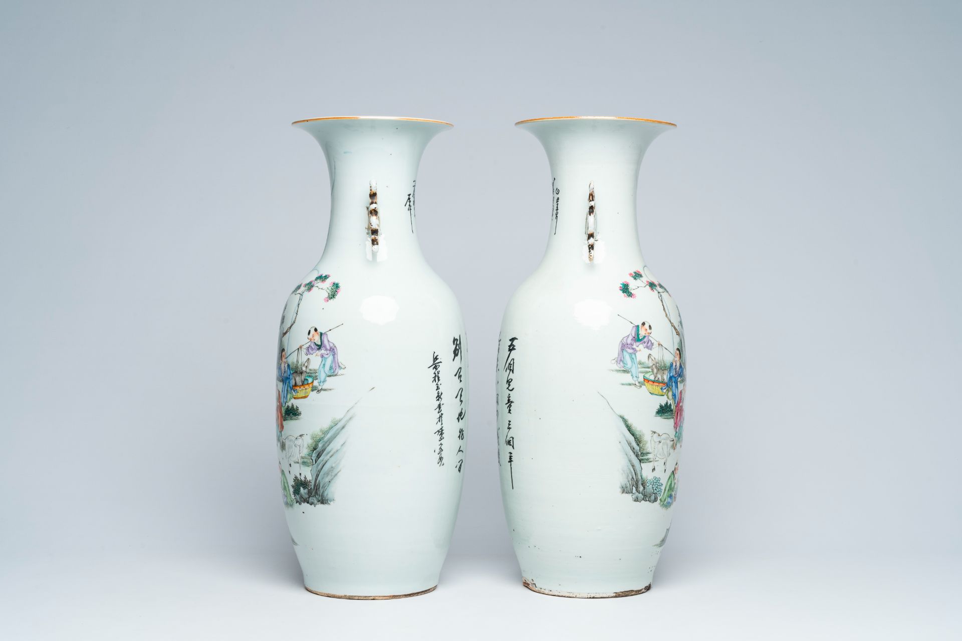 A pair of Chinese famille rose vases with playing children and goats in a landscape, 19th/20th C. - Image 3 of 7