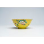 A Chinesefamille rose yellow-ground sgraffito bowl, Qianlong mark, 18th/19th C.