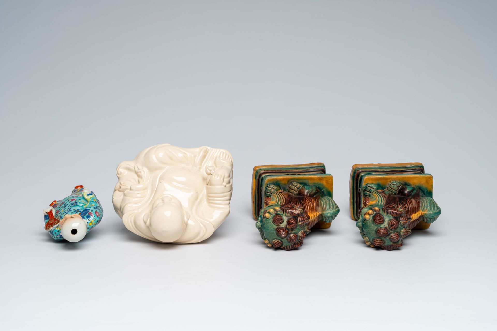 A Chinese blanc de Chine figure of Buddha, a pair of sancai glazed Buddhist lions and a famille rose - Image 6 of 10