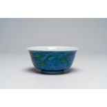 A Chinese blue, white and overglaze green 'dragons' bowl, Kangxi mark, 19th/20th C