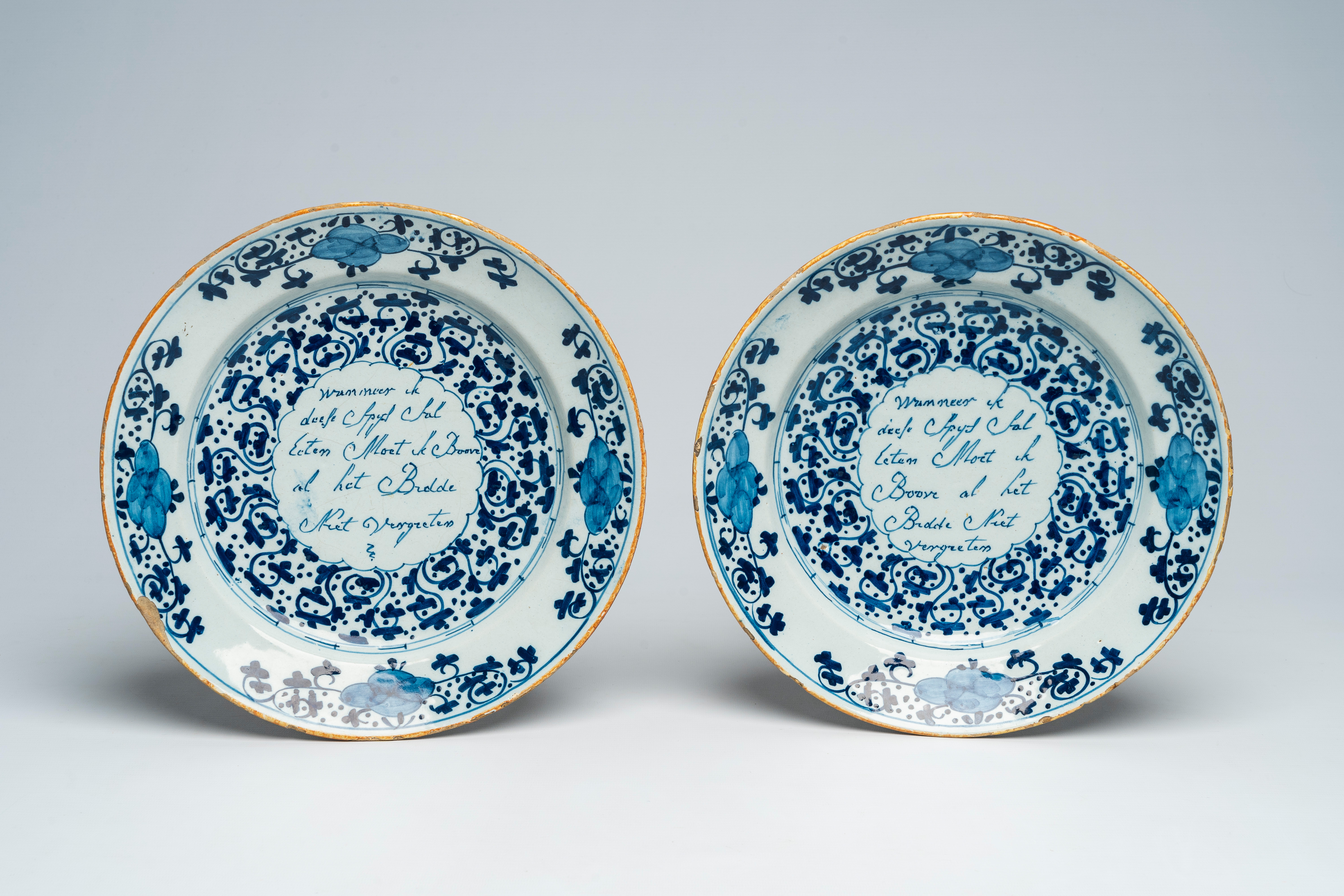 A pair of Dutch Delft blue and white 'text' plates, 18th C.