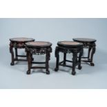 Four Chinese open worked carved wood stands with marble top, 19th/20th C.