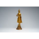 A Thai gilt bronze figure of a standing Buddha, Rattanakosin, 19th C.