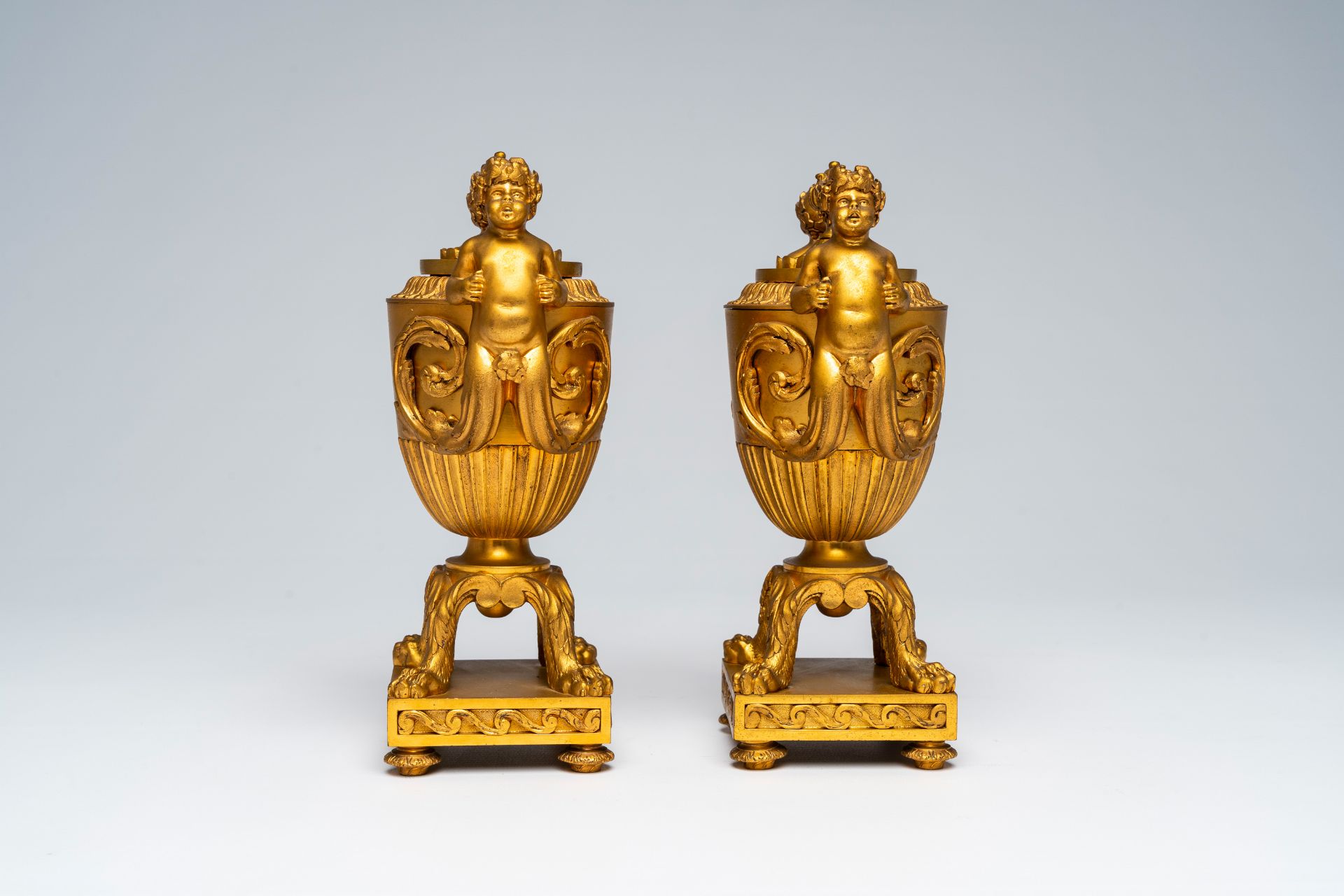 A pair of French gilt bronze vases and covers with bacchantes and lion's feet convertible into candl - Image 6 of 8