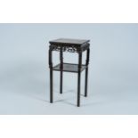 A Chinese reticulated carved wood stand with marble top, 19/20th C.