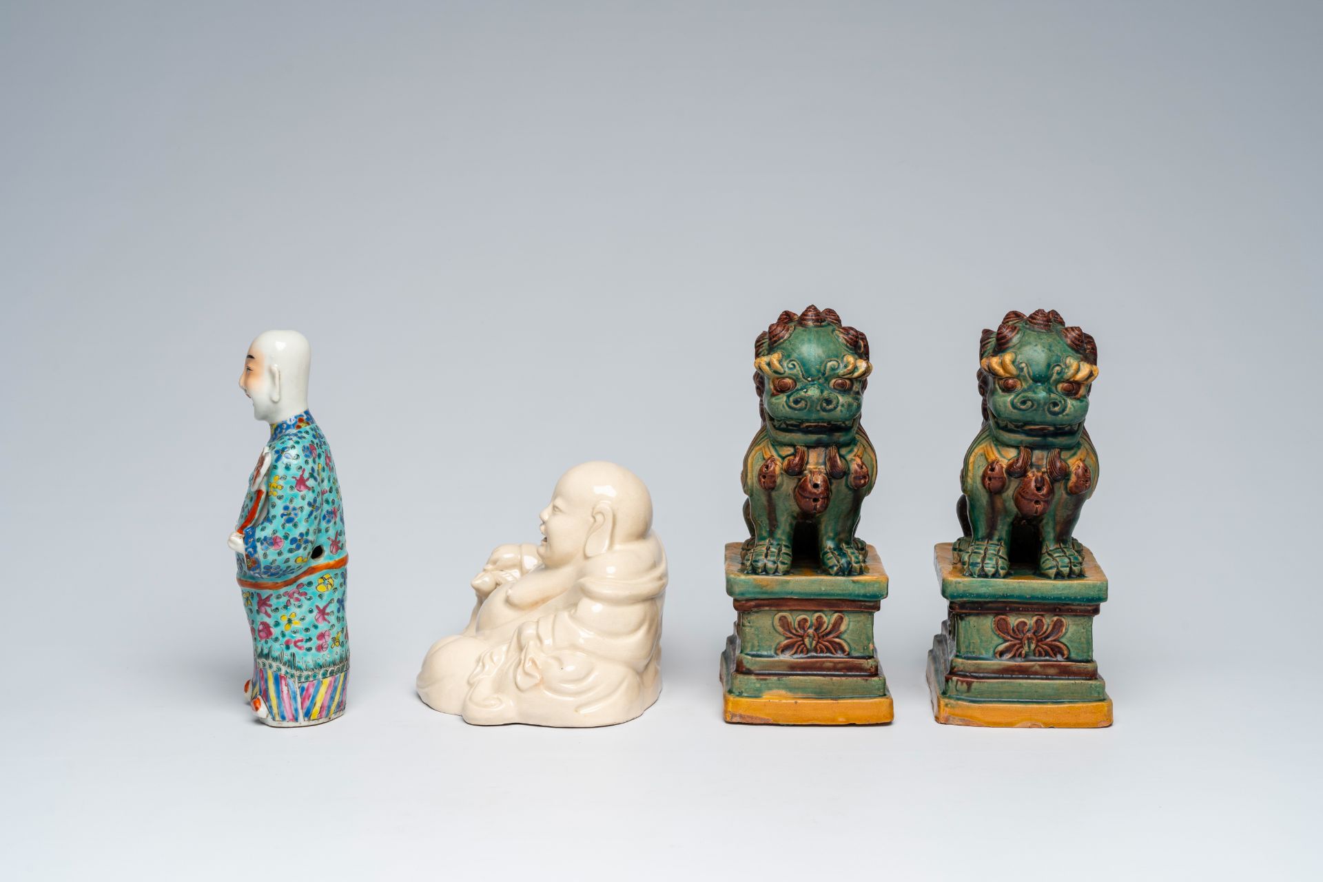 A Chinese blanc de Chine figure of Buddha, a pair of sancai glazed Buddhist lions and a famille rose - Image 3 of 10