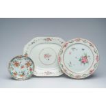 A Chinese famille verte plate and two famille rose chargers with floral design, Kangxi/Qianlong