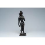 A large Nepalese patinated bronze figure of a standing Tara on a lotus throne, 19th/20th C.