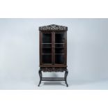 A Japanese wood two-door 'dragons chasing the pearl' display cabinet, first half 20th C.