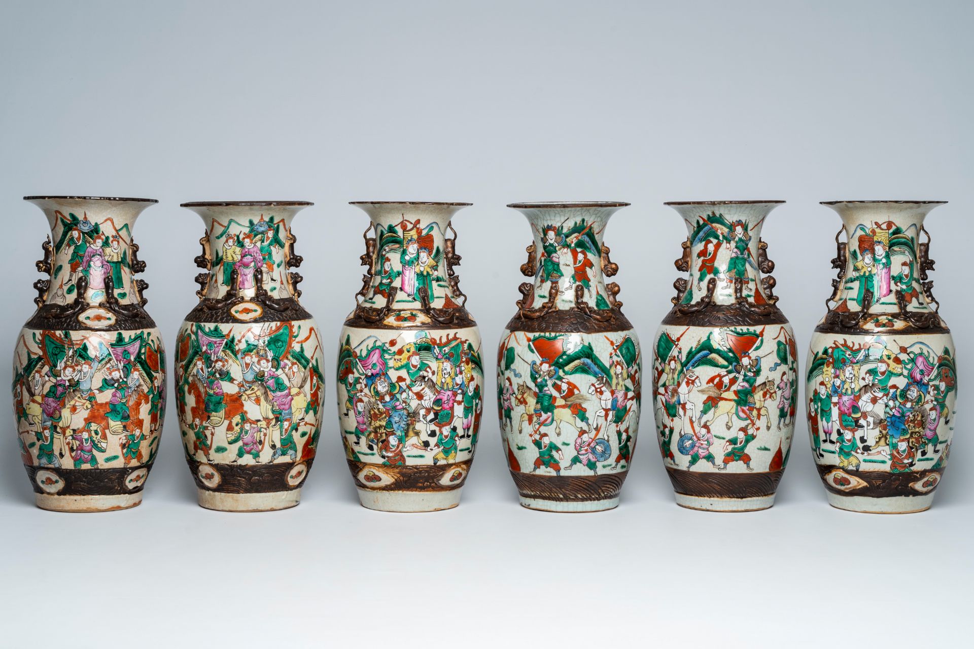 Three pairs of Chinese Nanking crackle glazed famille rose 'warrior' vases, 19th C.