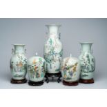 Three Chinese famille rose and qianjiang cai vases with ladies in a garden and two jars and covers,