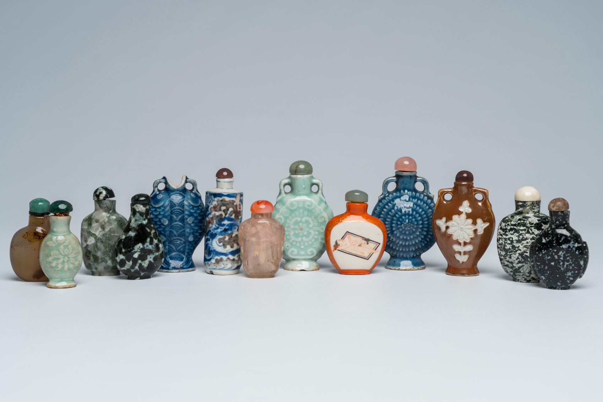 Thirteen various Chinese porcelain, hardstone, quartz and agate snuff bottles, 19th/20th C.